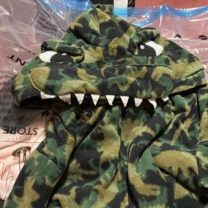 A boys dinosaur onesie
